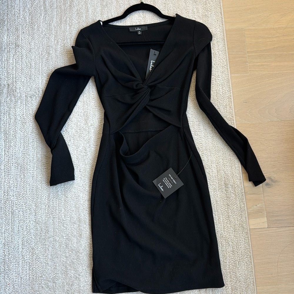 Black dress with part of stomach exposed super cute brand new with tags